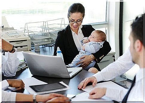 find the right balance: mother with baby at meeting