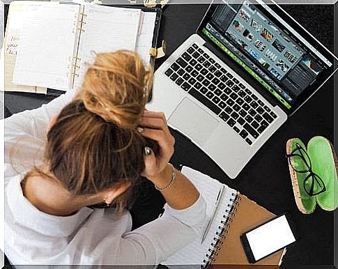 find the right balance: woman looks overwhelmed at work