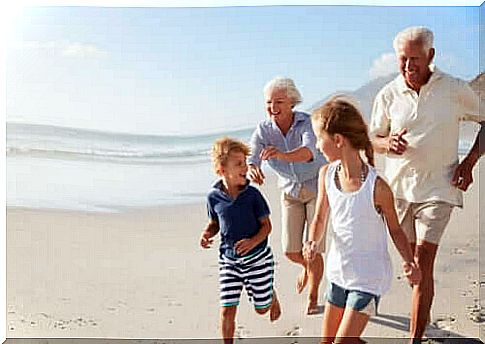 remember their grandparents: family running on beach