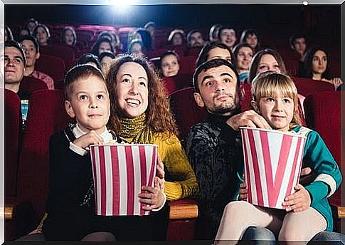 Family at the cinema with popcorn