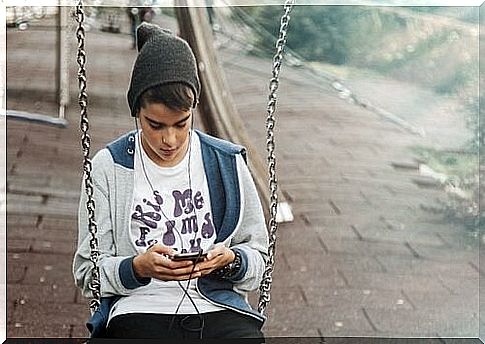 A teenager with his phone.