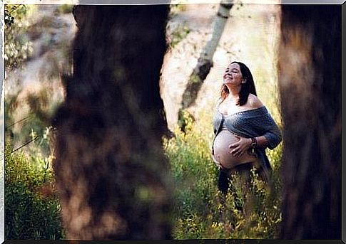 pregnant woman in forest