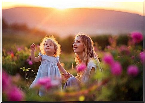 Mother and daughter in meadow