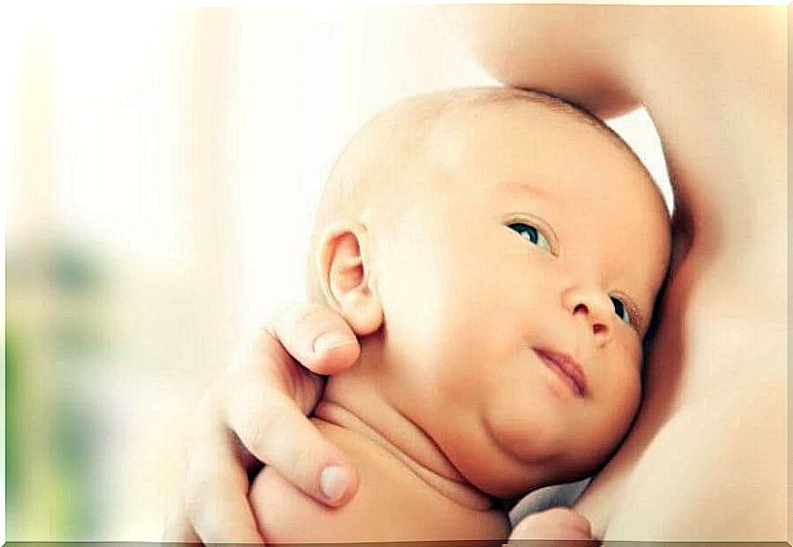 mom holding newborn baby