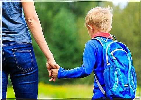 Mother and boy go to school