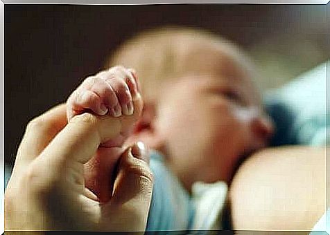 children breastfeed and hold hands