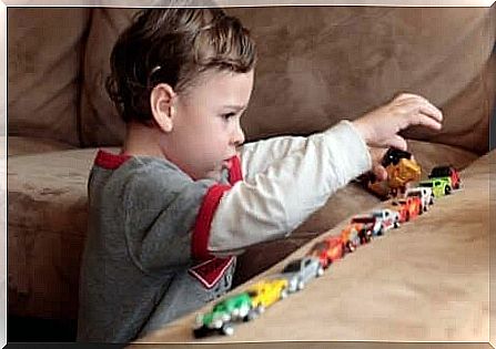 A child with disintegrating disorder in children plays on the couch.