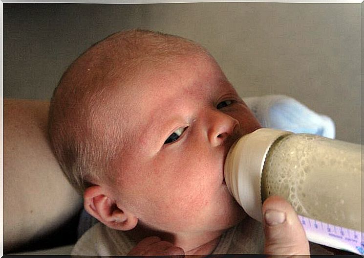 Baby eats from bottle