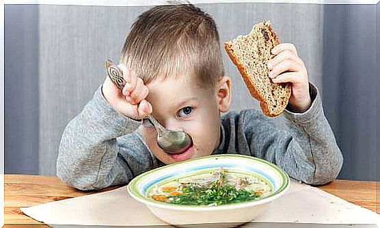 A child eats healthy soup.