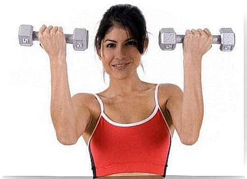 Exercises That Can Strengthen Your Stomach: Happy Woman Holding Up Dumbbells