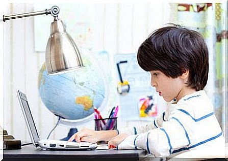 children learn from their parents: boy at desk