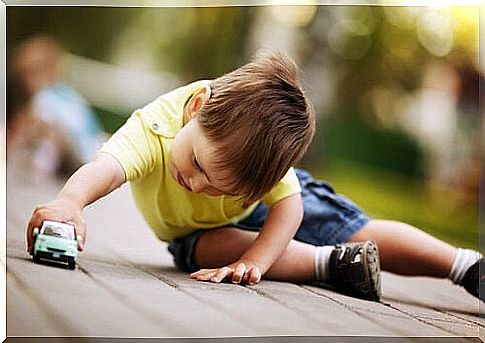 Boy with toy car