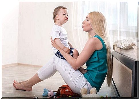 woman interacting with baby