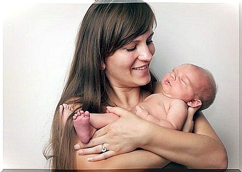 mom holding baby