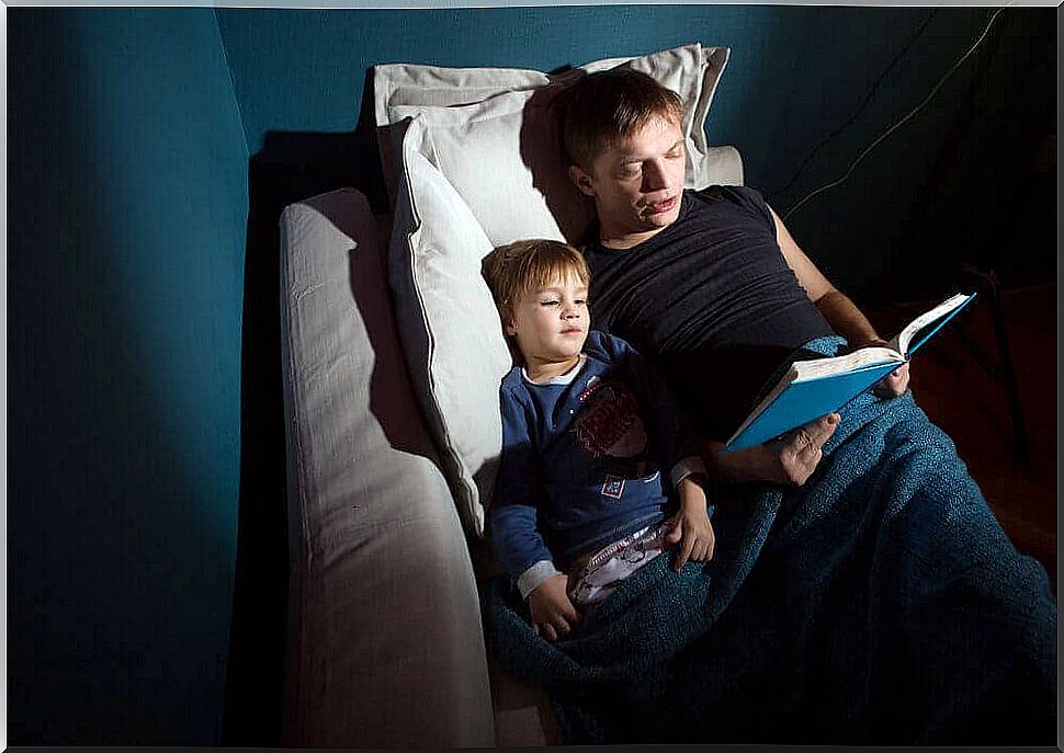 dad reads scary ghost stories to his son