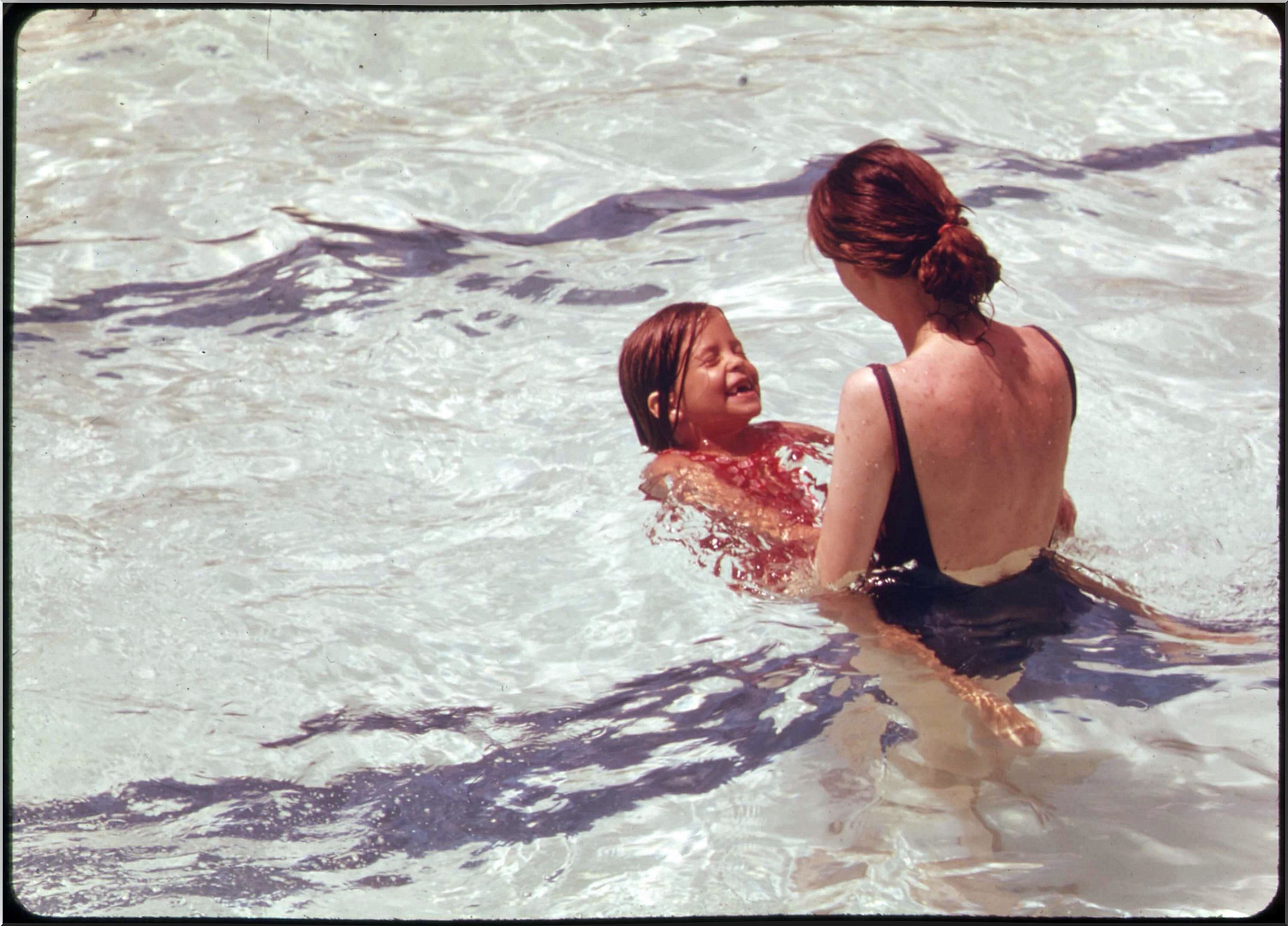 mother and daughter in pool