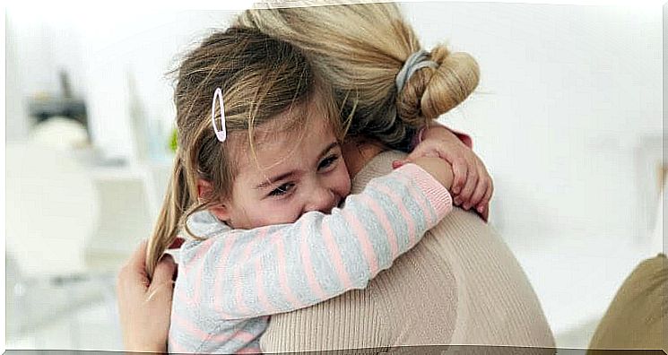 Mom hugs daughter