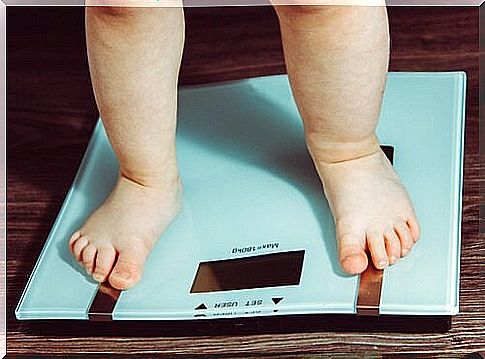 Children standing on scales.