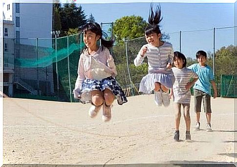 children jump skipping rope