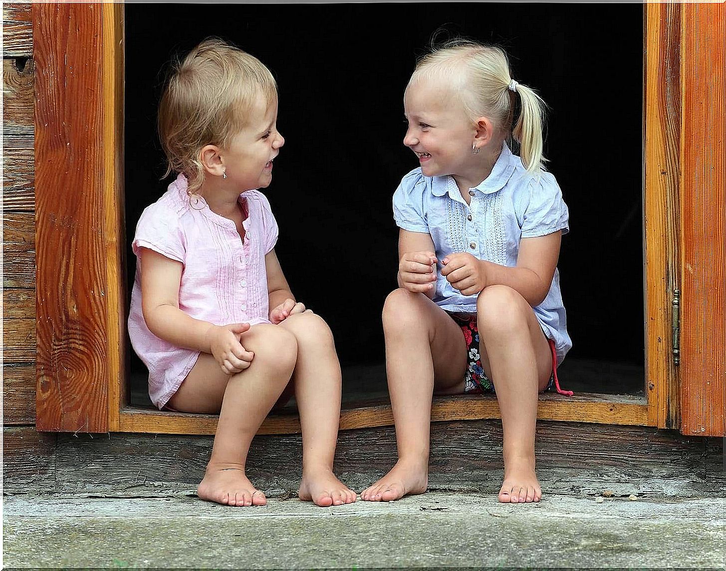 two children talking