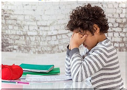 sleepy child sitting at table