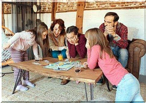 Family playing board games together.