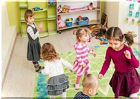 Children play together in a playroom.