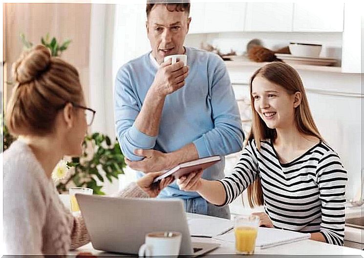 positive and negative reinforcement: happy family around homework