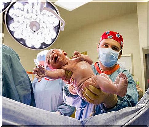 The gait reflex: doctor delivering baby