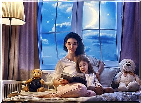 Mom reads bedtime story to children