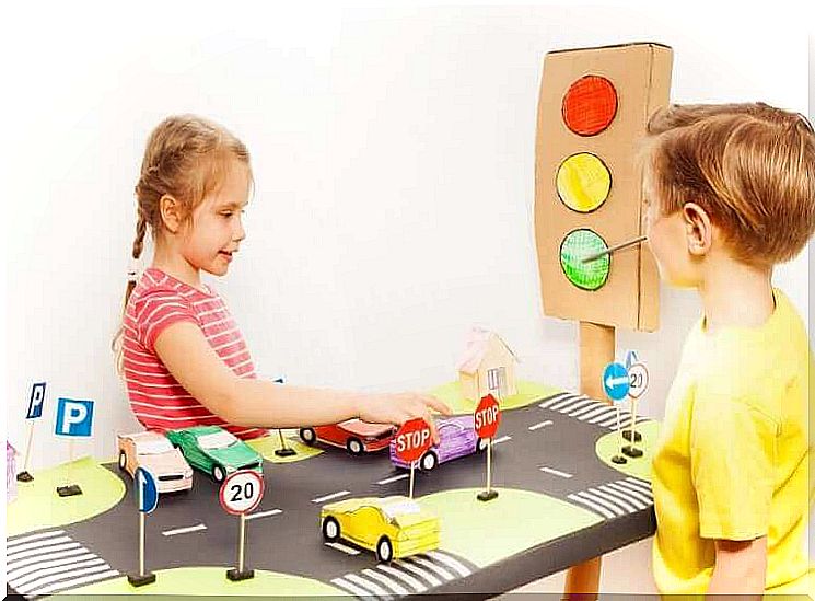 Children play with cars