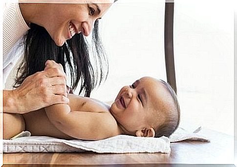 Mom and baby laughing.