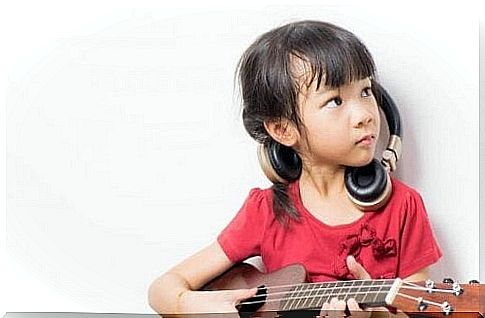 A girl is playing a musical instrument.